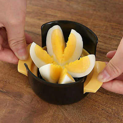 coupe-oeuf-personne-qui-a-couper-un-oeuf-en-quartier