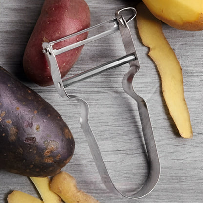 eplucheur-sur-la-table-avec-les-legumes